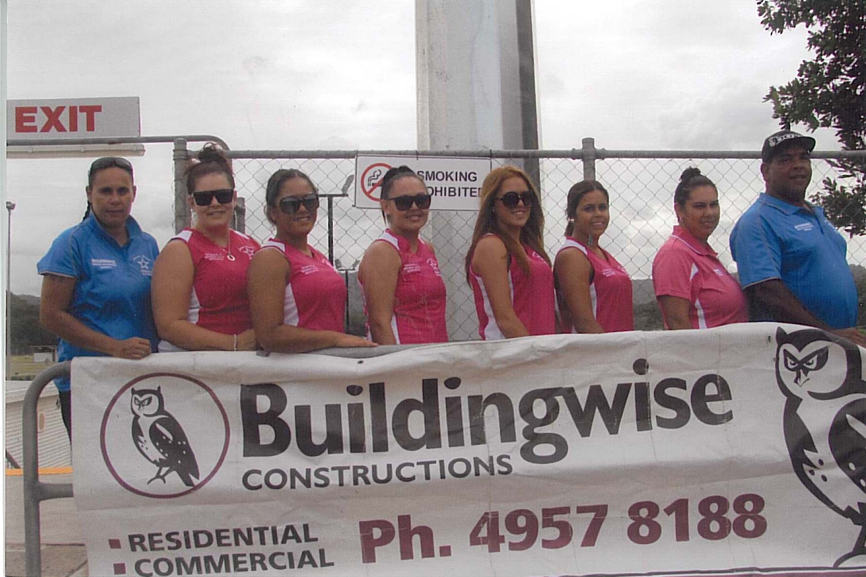 Buildingwise Sponsors Ella 7's Rugby Team, Buildingwise banner with female rugby team